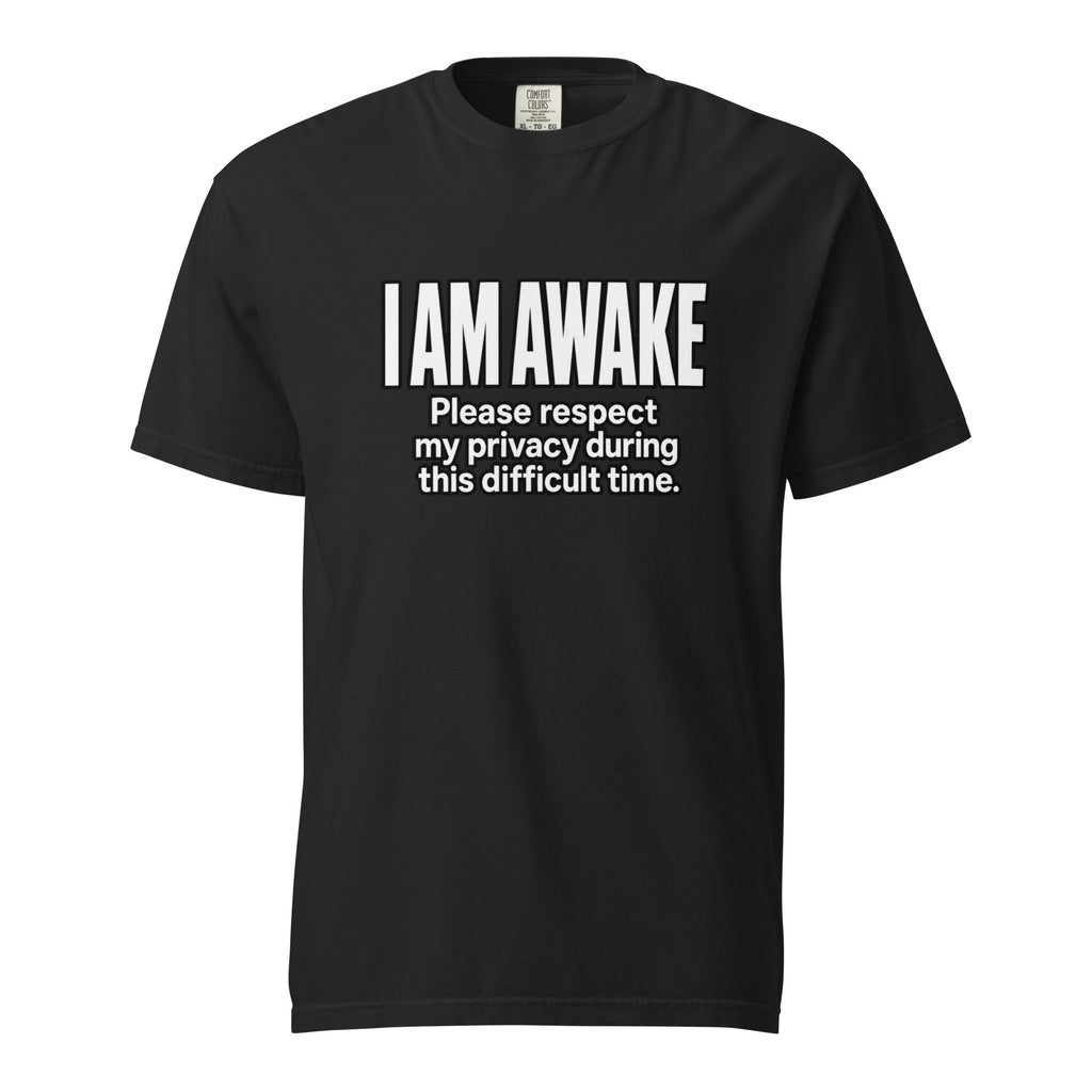 Front view of a black T-shirt featuring an awareness slogan reading “I AM AWAKE” and “Please respect my privacy during this difficult time.”