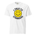 Front view of a white T-shirt featuring a yellow smiley face and black text reading “I TALK TO STRANGERS.”