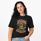 I Ve Survived Too Many Storms Funny Raccoon t shirt in Black worn by a studio model in an upper-body front relaxed pose on a clean white background