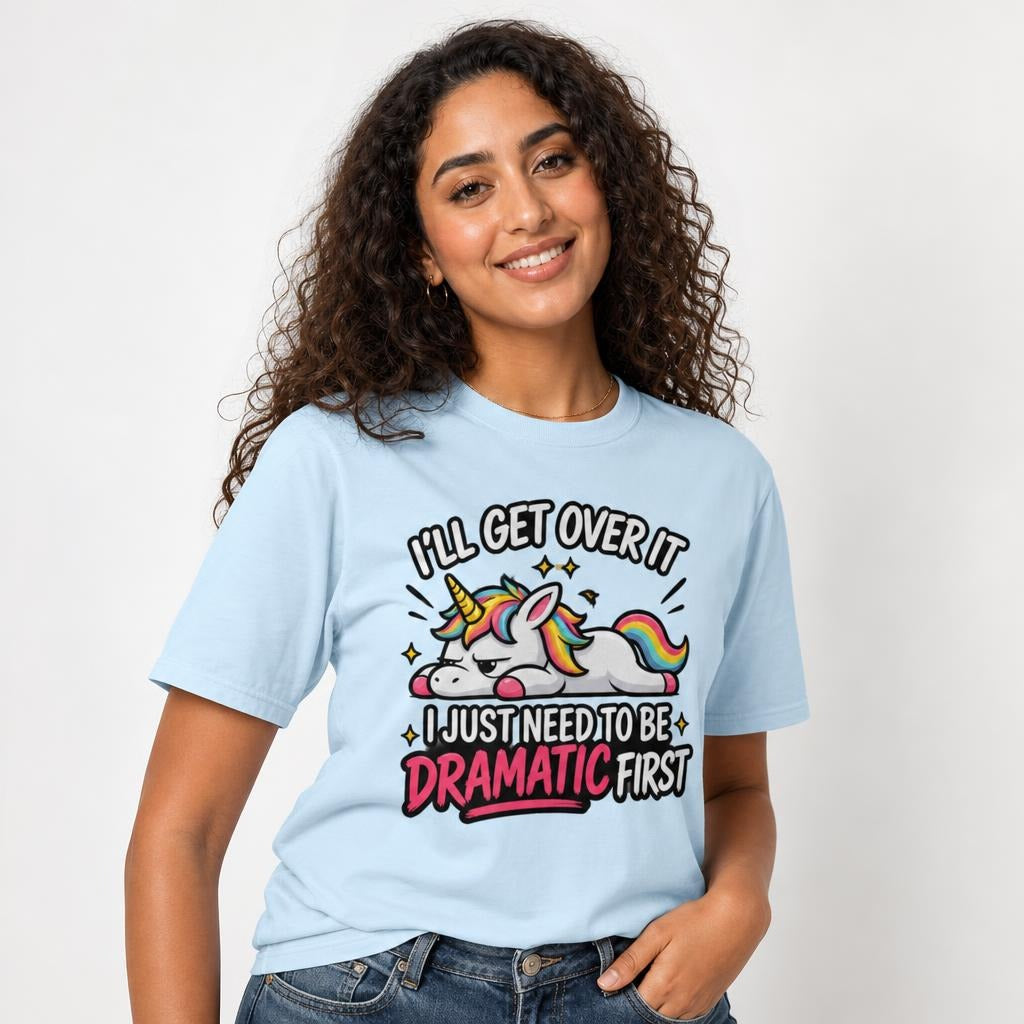Front view of a Chambray T-shirt featuring a colourful cartoon unicorn with a rainbow mane, sparkles, and dramatic lettering.