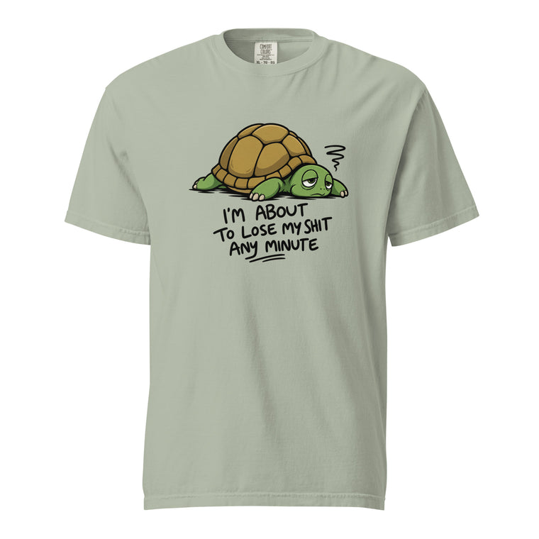 Front view of a Bay T-shirt featuring a sleepy-eyed cartoon turtle with a brown shell and the text “I’M ABOUT TO LOSE MY SHIT ANY MINUTE.”