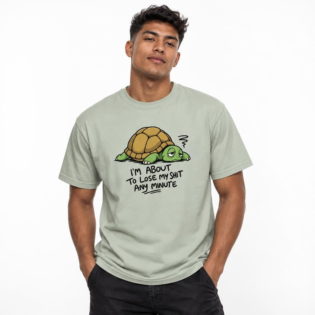 Model wearing a Bay T-shirt featuring a tired, sleepy-eyed cartoon turtle with a brown shell, green body, stress mark, and bold text.