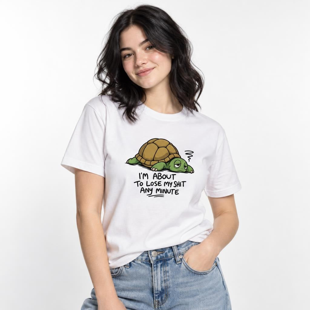 Model wearing a white T-shirt with a tired cartoon turtle and the text “I’M ABOUT TO LOSE MY SHIT ANY MINUTE.”