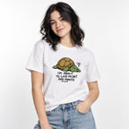 Model wearing a white T-shirt with a tired cartoon turtle and the text “I’M ABOUT TO LOSE MY SHIT ANY MINUTE.”