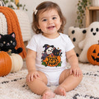 Baby wearing a white short sleeve bodysuit with two black cats, pumpkins, and a Trick or Treat Halloween design