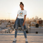Latina woman wearing a white autism awareness puzzle heart t-shirt.