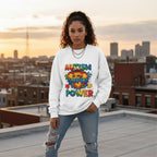 Latina woman wearing a white Autism is My Superpower sweatshirt.