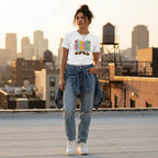 Latina woman wearing a white autism awareness patchwork panel t-shirt.