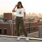 Latina woman wearing a white rainbow turtle t-shirt.