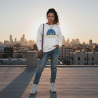 Latina woman wearing a white Be Kind autism awareness sweatshirt.