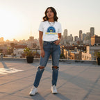 Latina woman wearing a white Be Kind autism awareness t-shirt.