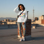 Latina woman wearing a white God Says I Am autism awareness sweatshirt.