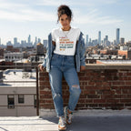 Latina woman wearing a white autism awareness t-shirt.