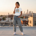 Latina woman wearing a white t-shirt with "I'm not misbehaving I have autism" design.