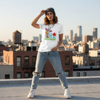 Latina woman wearing a white its ok to be different autism awareness giraffe t-shirt.