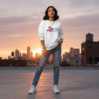 Latina woman wearing a white love needs no words autism awareness sweatshirt.