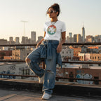 Latina woman wearing a white retro sunset puzzle autism awareness t-shirt.