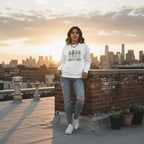 Latina woman wearing a white skeleton puzzle sweatshirt.