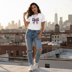 Latina woman wearing a white autism awareness puzzle piece bow t-shirt in a streetwear style.