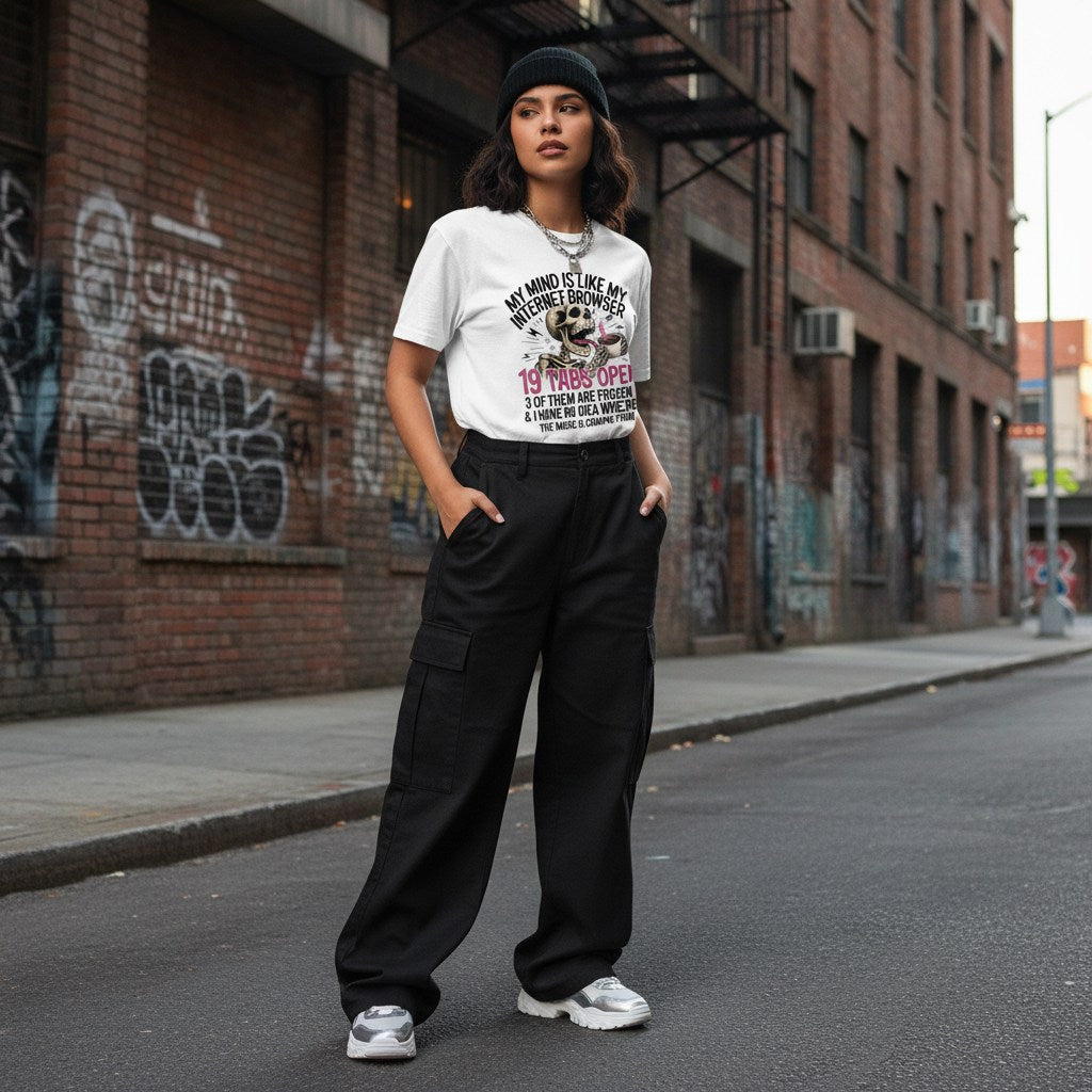 Latina woman in streetwear posing outdoors wearing a white t-shirt