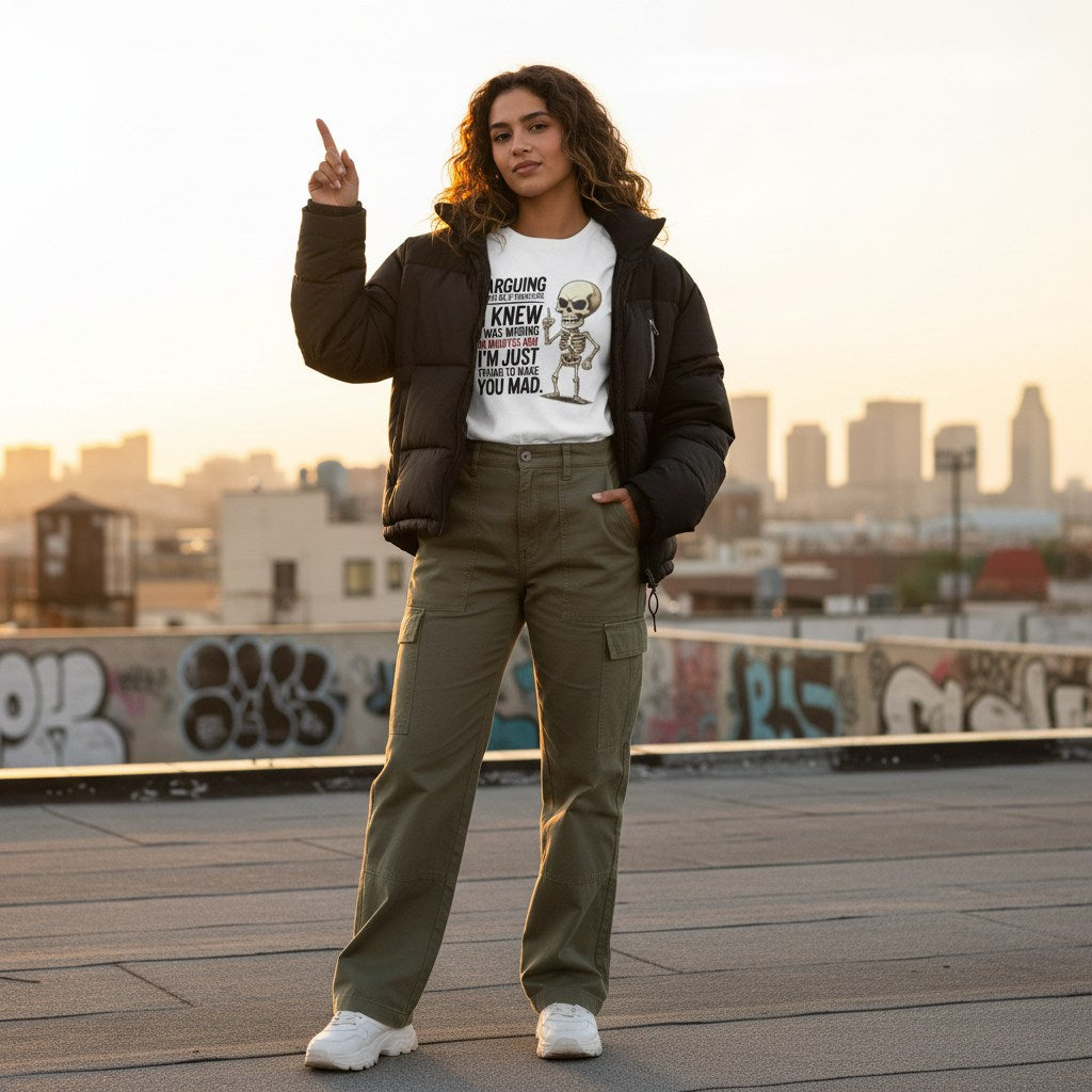Latina woman wearing a white t-shirt and posing in an urban streetwear setting