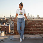 Latina woman wearing a white support squad autism awareness t-shirt.