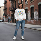 Latina woman wearing a white autism awareness sweatshirt.