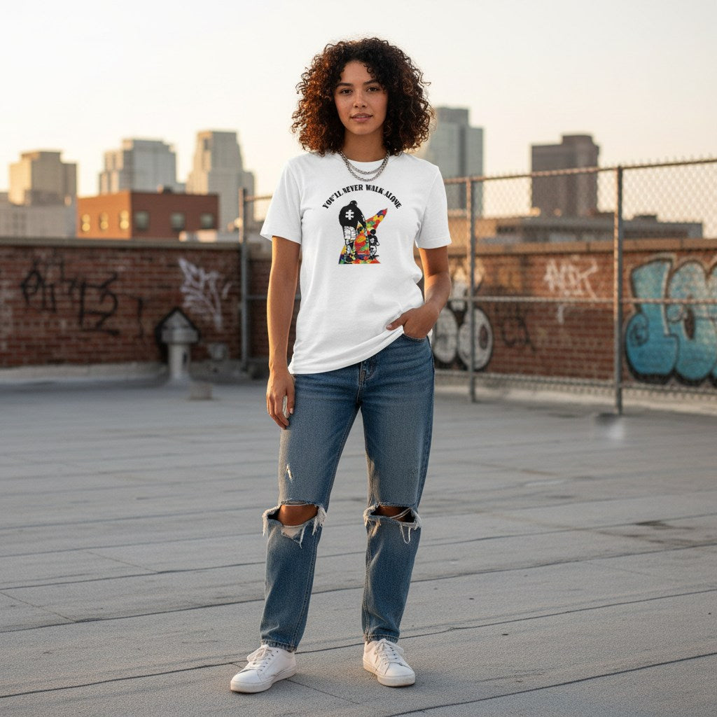 Latina woman wearing a white You'll Never Walk Alone autism awareness t-shirt.