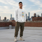 Latino man wearing a white autism flag sweatshirt.