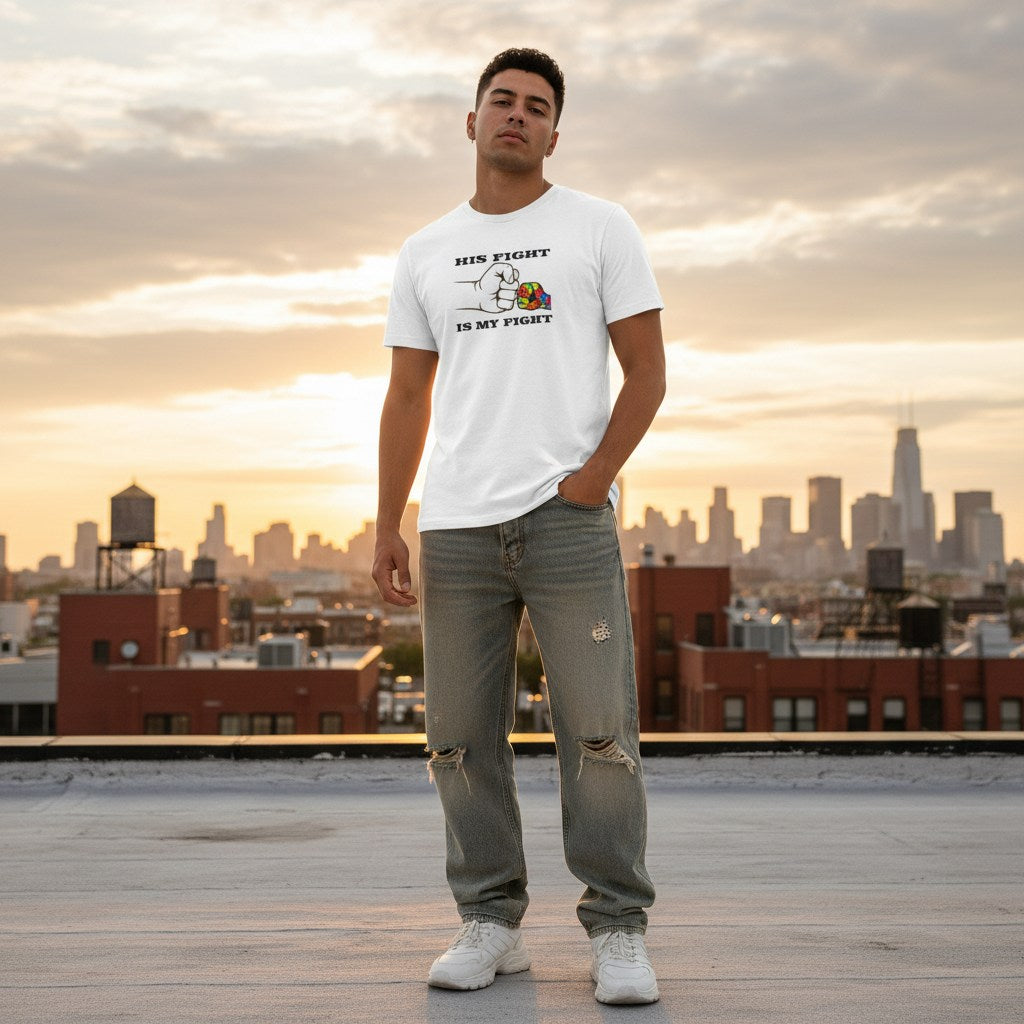 Latino man wearing a white autism awareness t-shirt.