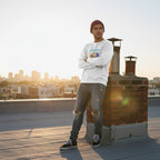 Latino man wearing a white "Its Okay To Be Different" autism awareness elephant sweatshirt.