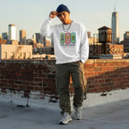 Latino man wearing a white autism awareness sweatshirt in a streetwear style.