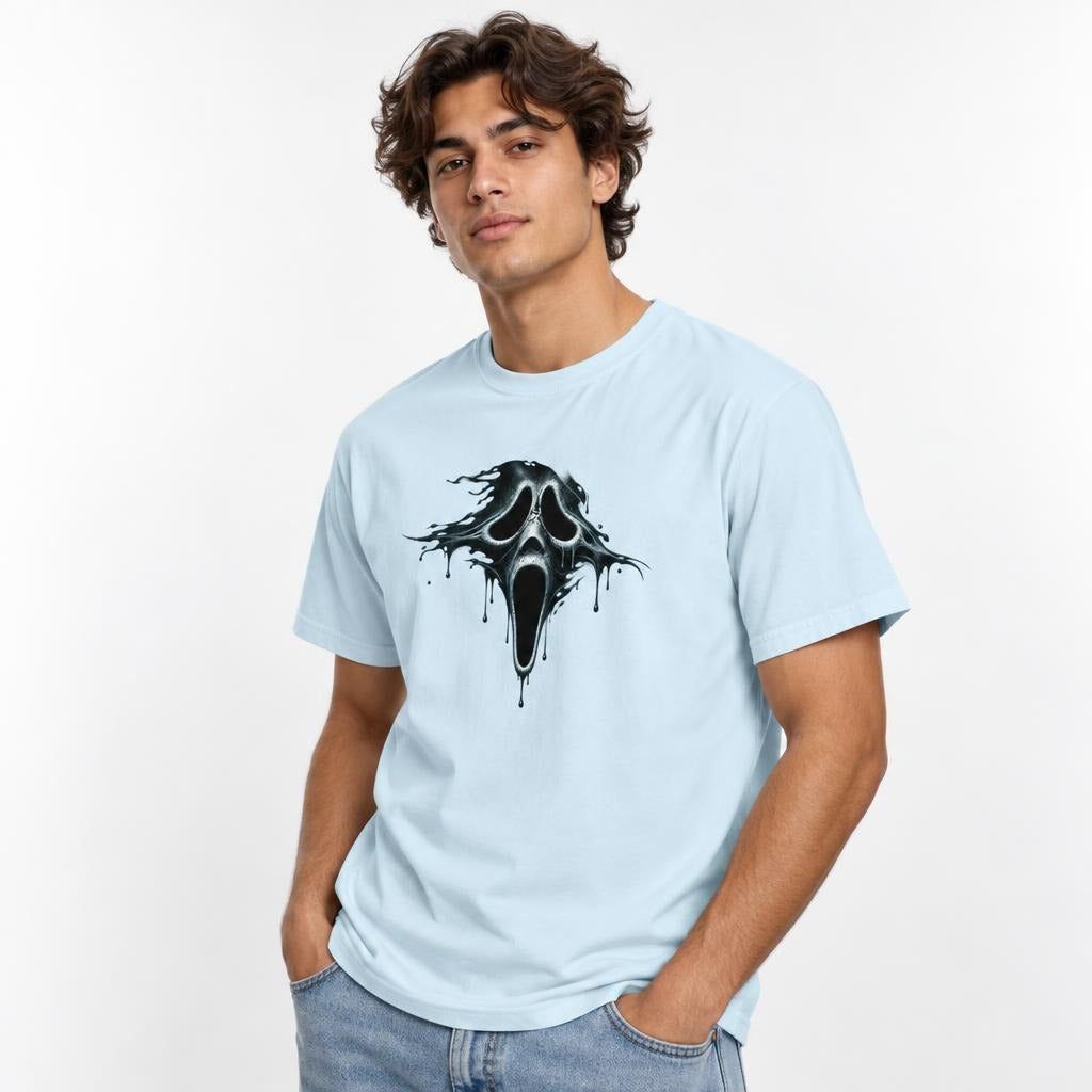 Model wearing a Chambray T-shirt with a central black melting ghost skull graphic, hollow eyes, open mouth, and dripping edges.