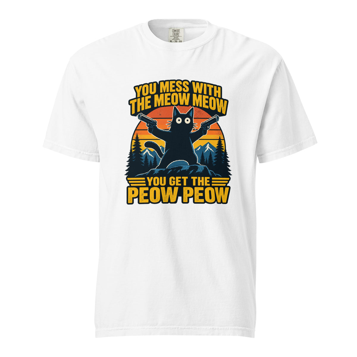 Front of a white T-shirt featuring a black cat holding two pistols before a striped sunset, mountains, pine trees, and yellow text.