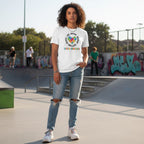 Middle Eastern non-binary person wearing a white autism awareness puzzle heart T-shirt in a streetwear style.
