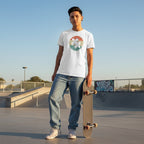 Middle Eastern non-binary person wearing a white autism awareness t-shirt in a retro sunset puzzle design.