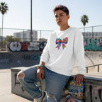 Middle Eastern non-binary person wearing a white autism awareness puzzle bow sweatshirt in a streetwear style.
