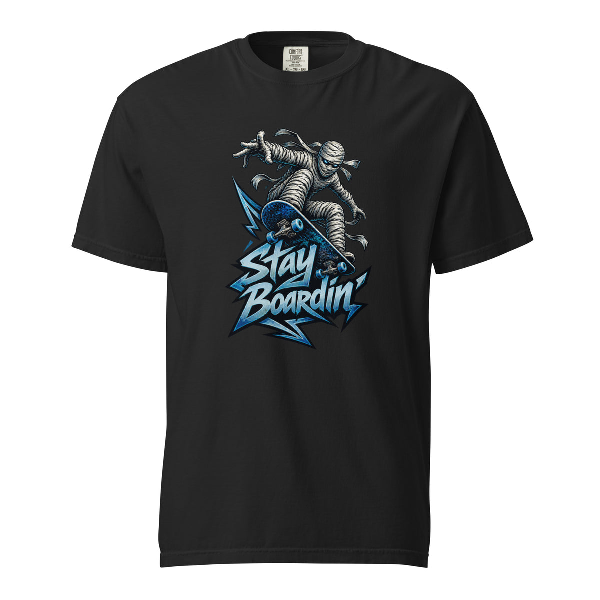 Black T-Shirt featuring a bandage-wrapped mummy riding a blue skateboard above bold “Stay Boardin’” lettering and angular blue accents.