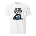 White T-shirt with bold text above a black-and-white cat clutching a blue yarn ball with loose strands around it.