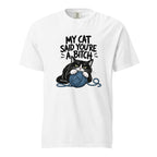 White T-shirt with bold text above a black-and-white cat clutching a blue yarn ball with loose strands around it.