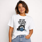 Front view of a model wearing a white T-shirt with “MY CAT SAID YOU’RE A BITCH” above a black-and-white cat clutching a blue yarn ball.