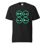 Front view of a black T-shirt with four outlined neon-green emoji faces in a two-by-two grid, showing varied expressions.