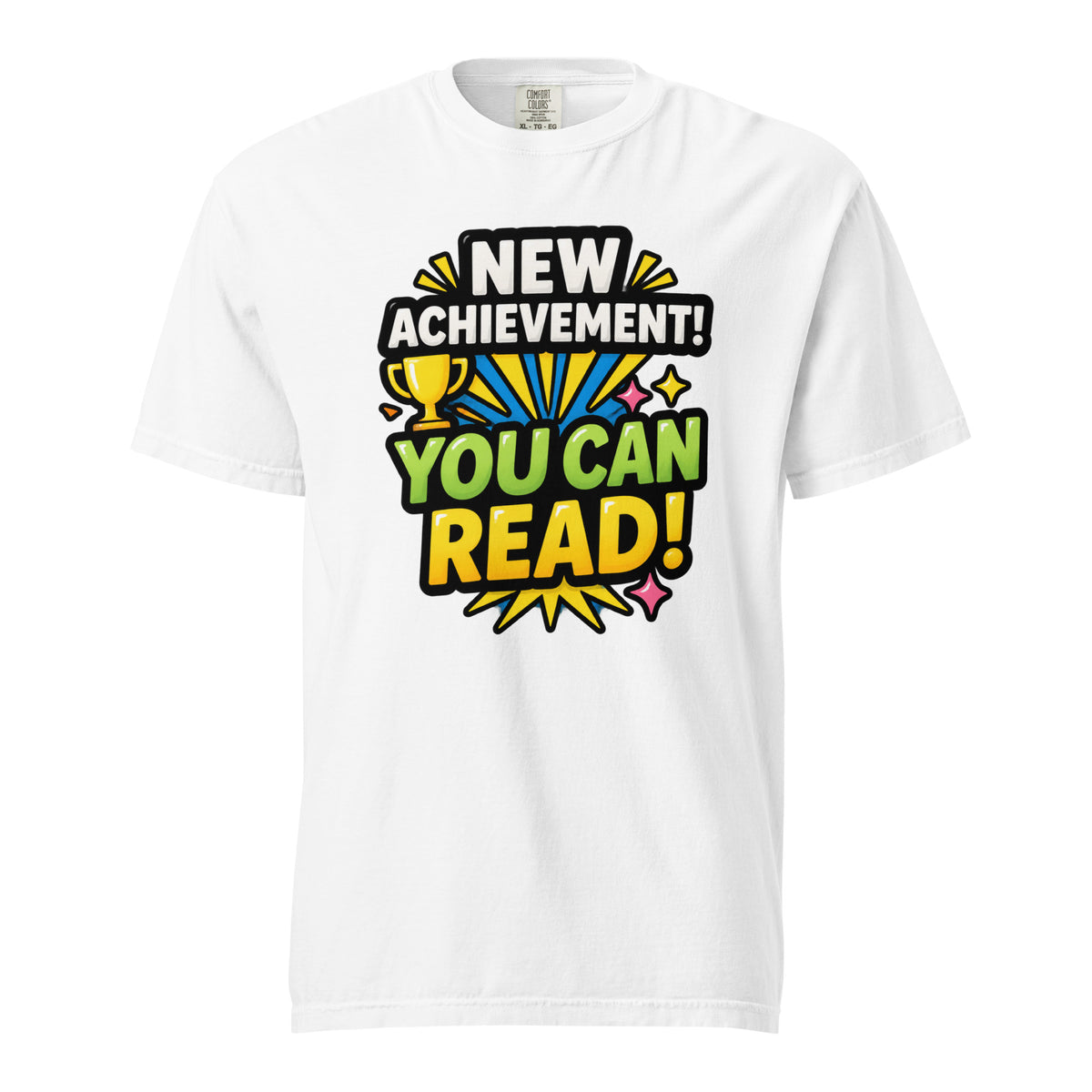 Front view of a white T-shirt with colourful text reading “NEW ACHIEVEMENT! YOU CAN READ!” and a yellow trophy.