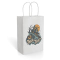 White paper gift bag featuring a spooky haunted house, pumpkins, bats, and “Trick or Treat?” artwork.