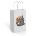 White paper gift bag featuring a Halloween haunted house illustration with a full moon and “Trick or Treat” lettering.