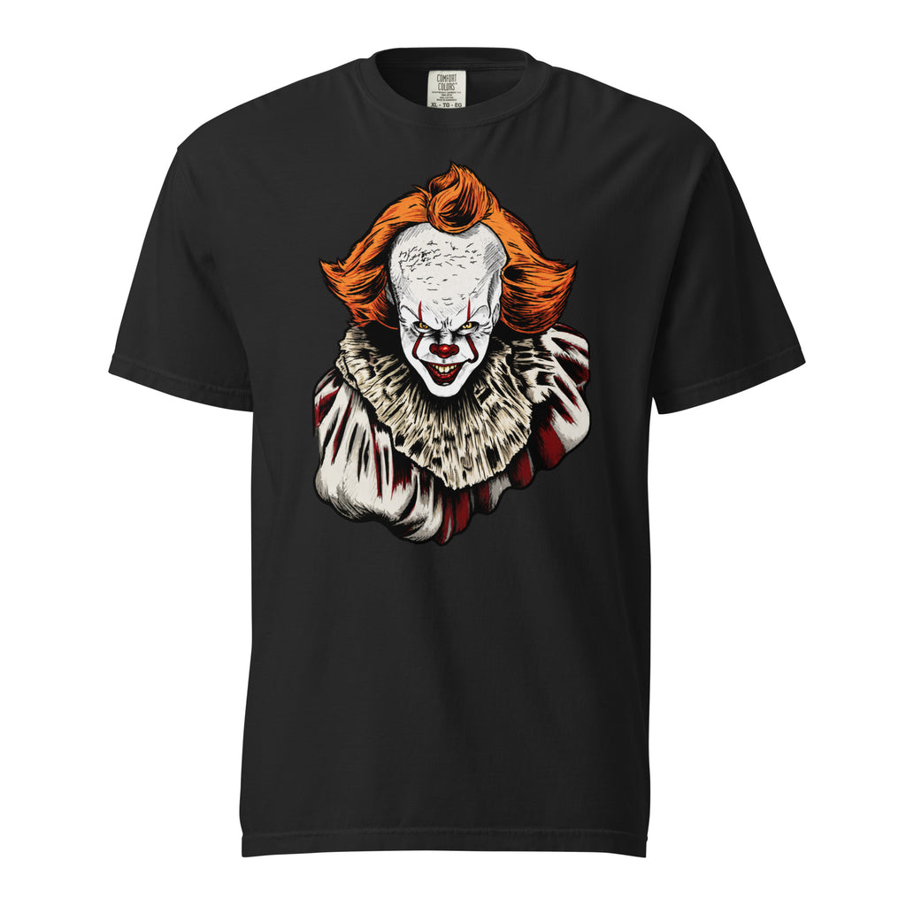 Front view of a black T-shirt featuring a sinister clown with bright orange hair, red nose, sharp teeth, and a ruffled costume.