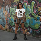 Latina woman wearing a personalities tee in a streetwear style shot.
