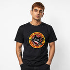Front view of a black T-shirt featuring a cartoon black cat with a knife, skull motifs, and a circular “PET FRIENDLY, HUMAN TOLERANT” caption.