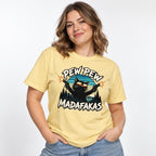Model wearing a Butter T-shirt featuring a black cat in sunglasses firing two pistols, with “PEW PEW” above and “MADAFAKAS” below.