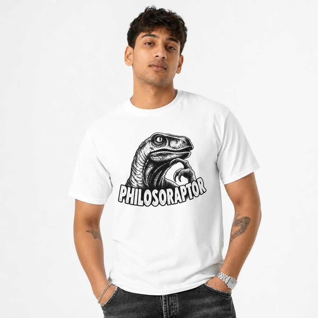 Front view of a white T-shirt featuring a black-and-white dinosaur with a raised claw and bold distressed “PHILOSORAPTOR” lettering.